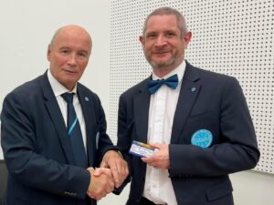 Geoff receiving his International A Class referee card from Yury Lakhtikov, Chairman of the WAKO Referee Ring Committee