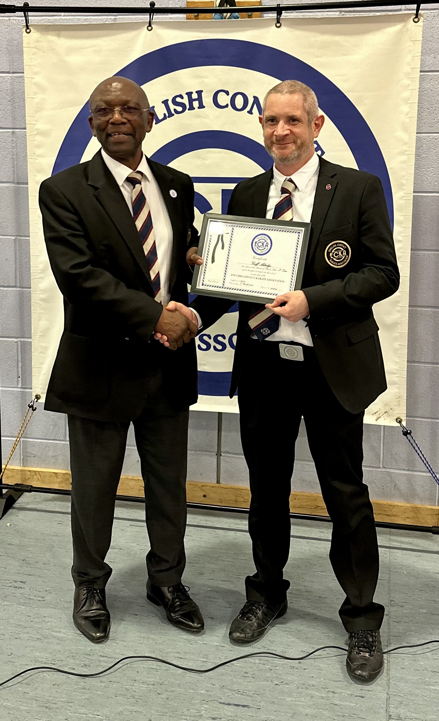 Geoff Aldridge receives 6th dan from Sensei Dev Barrett